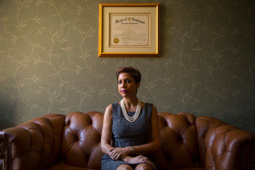 Judge Charbonnet seated on leather sofa